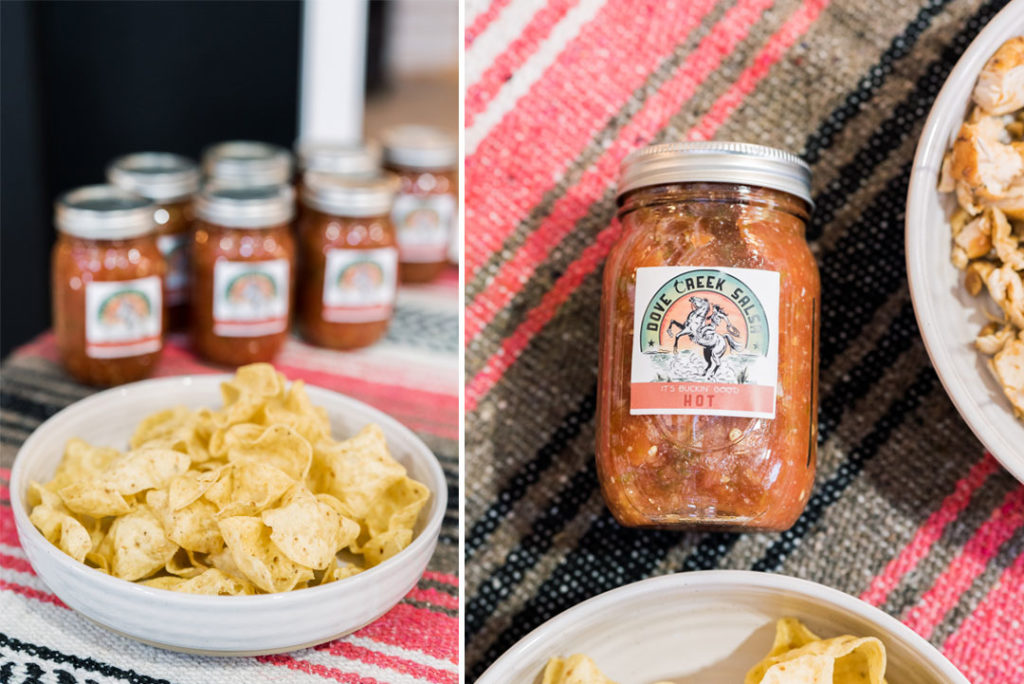 Dove Creek Ranch Buckin Good Salsa in mason jars on table with mexican blanket or navajo blanket with a bowl full of corn tortilla chips