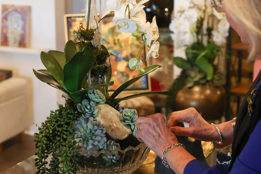 anne beddingfield arranging and making orchid and succulent floral design at reserve amarillo